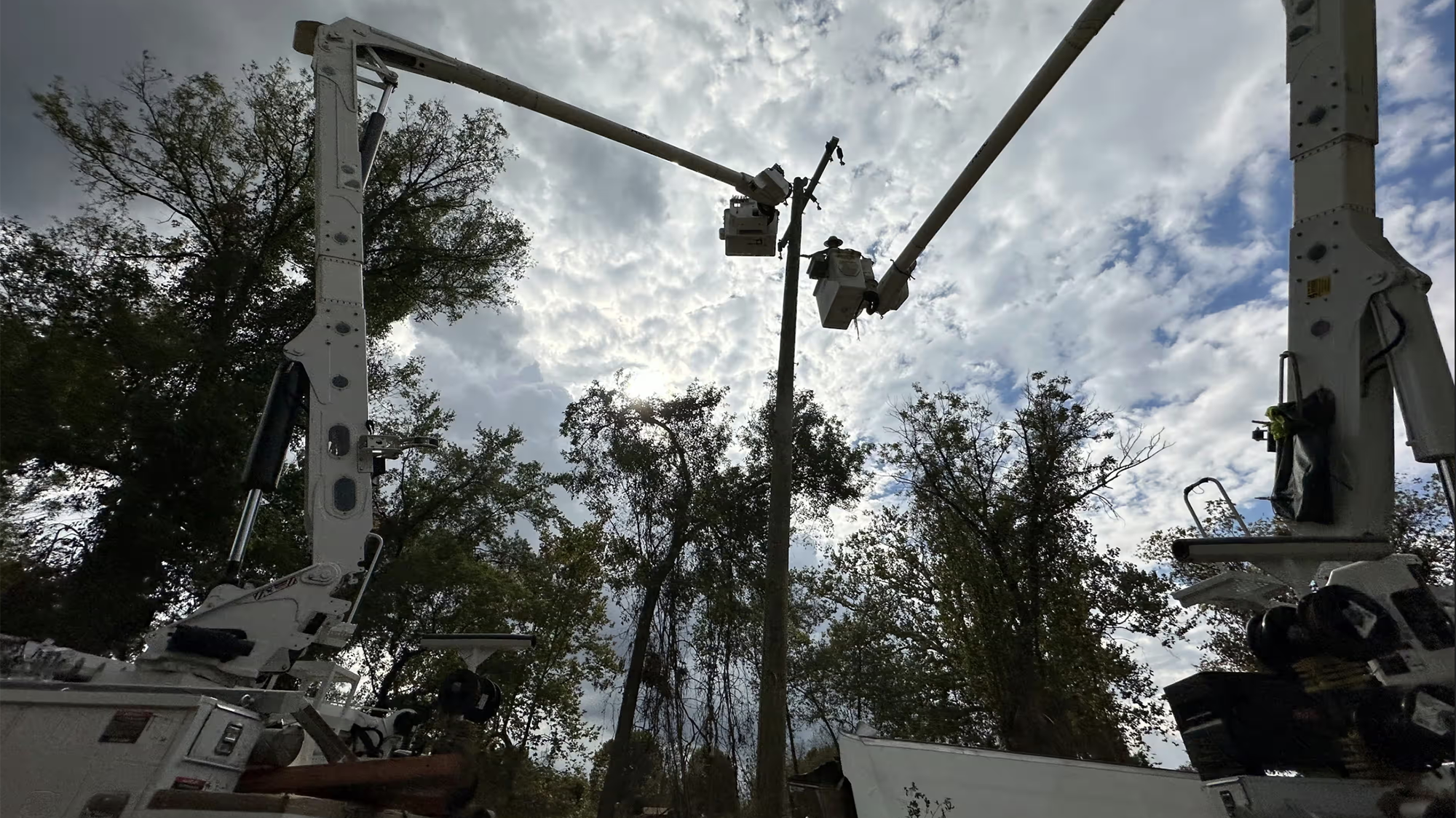 Contractors for Duke Energy rebuild destroyed electrical lines in North Carolina